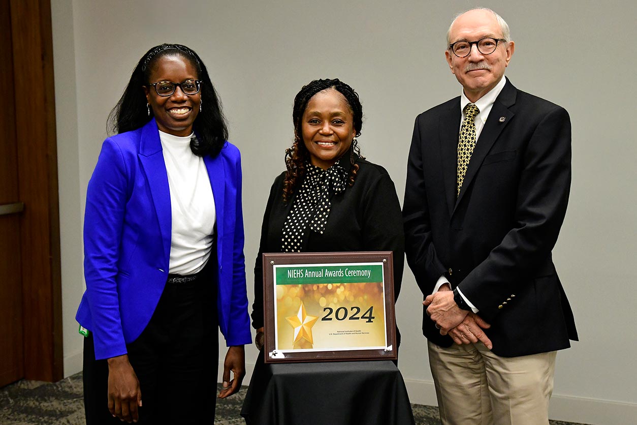 Executive Officer J’Ingrid Mathis, left, and Rick Woychik, right, Melissa Gentry, center,