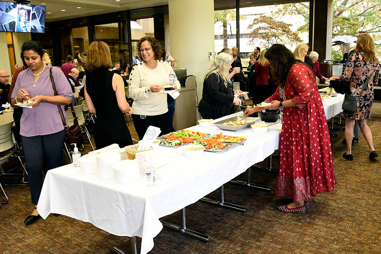 Attendees gathered in the NIEHS cafeteria for refreshments following the awards ceremony