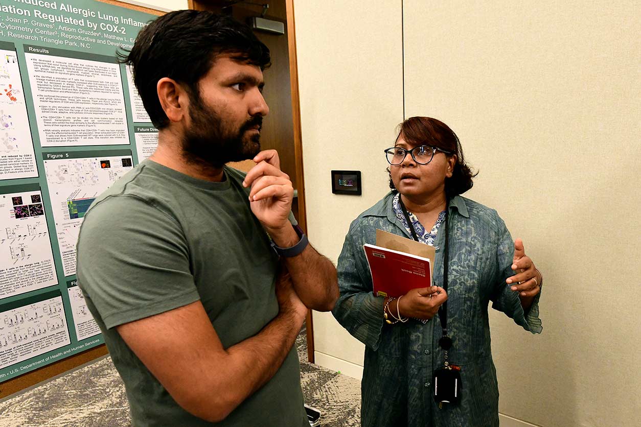 Mahina Monsur, Ph.D., a visiting fellow in the DNA Replication Fidelity Group who presented research on how cells repair damaged DNA, shares her research with meeting attendees