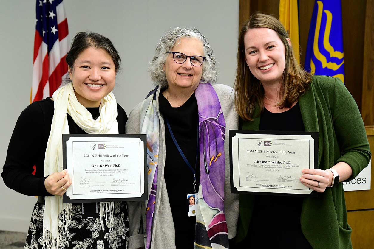 Dale Sandler, Ph.D., center, celebrates with Jennifer Woo, Ph.D., left, and Alexandra White, Ph.D., right