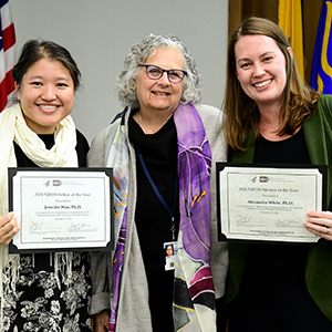 Dale Sandler, Ph.D., center, celebrates with Jennifer Woo, Ph.D., left, and Alexandra White, Ph.D., right