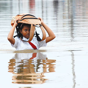 Girl walking through water