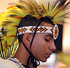 Young man wearing the traditional pecha, a mohawk-like headdress of a fancy dancer