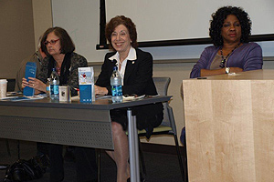 Panel members sitting at a table