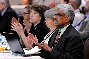 Federal representatives watch the presentation