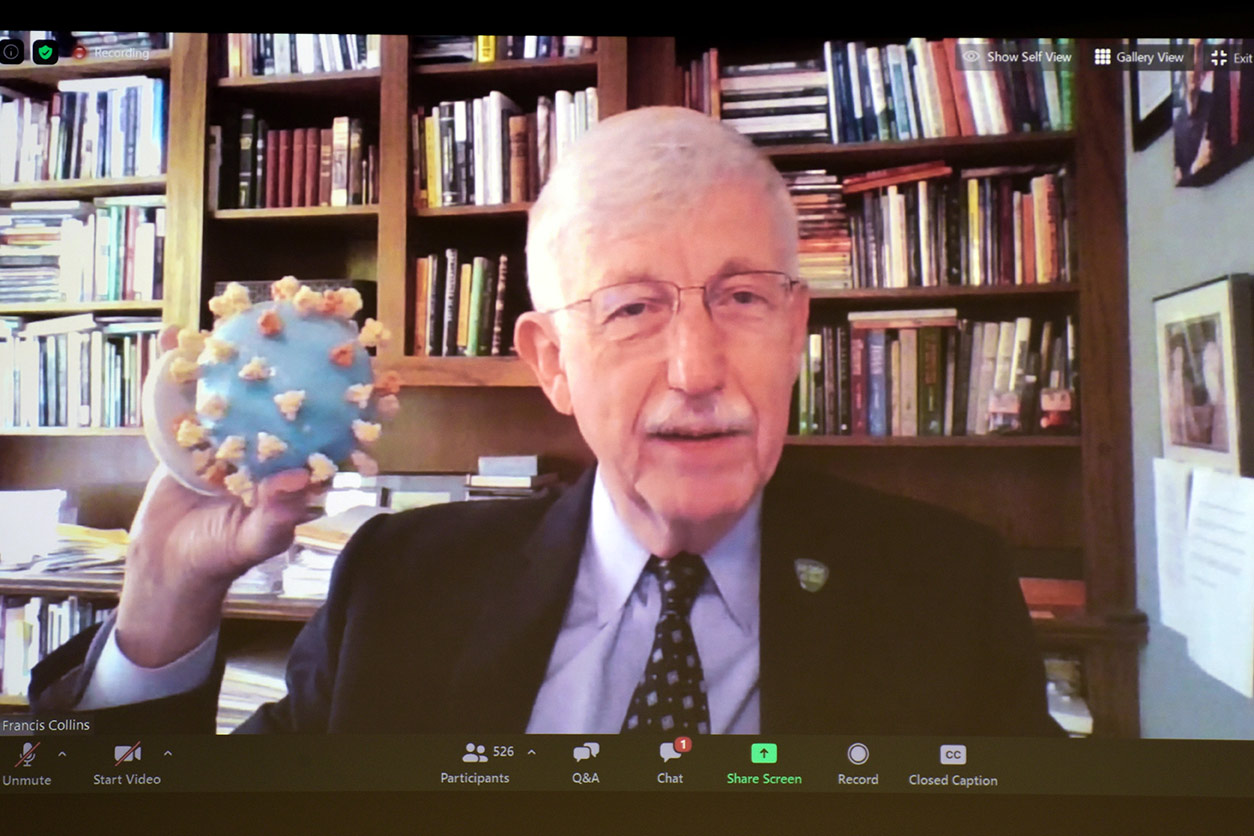 Francis Collins holds a model of SARS-CoV-2